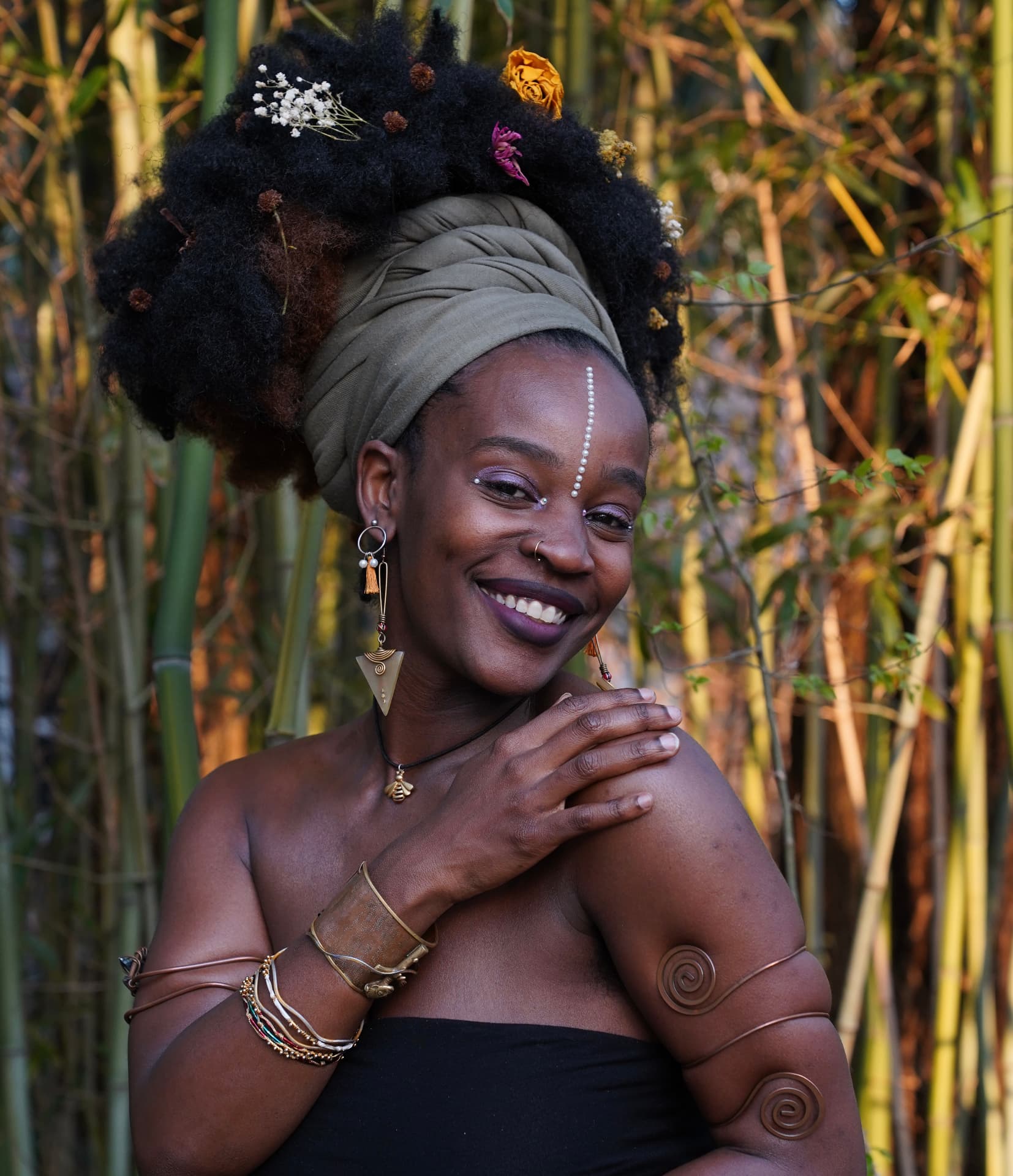 Shekinah Bell, portrait in bamboo with flowers in her hair